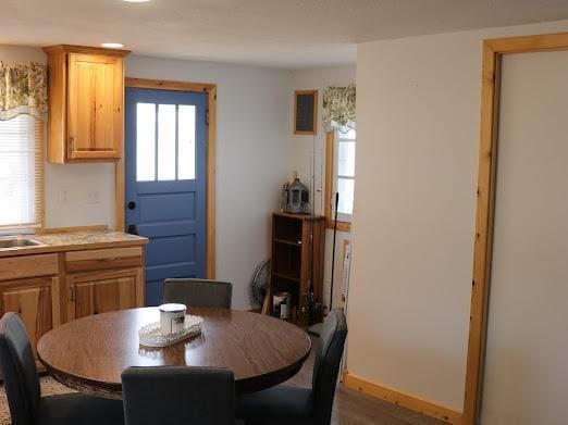 dining room with wood finished floors and baseboards