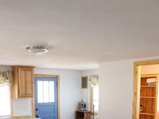 interior details featuring a textured ceiling