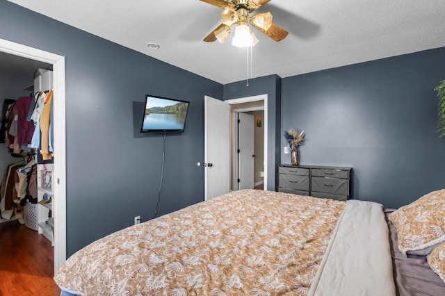 bedroom featuring wood finished floors and a ceiling fan