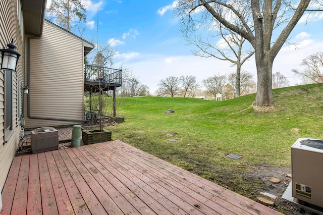 deck with a lawn and central AC