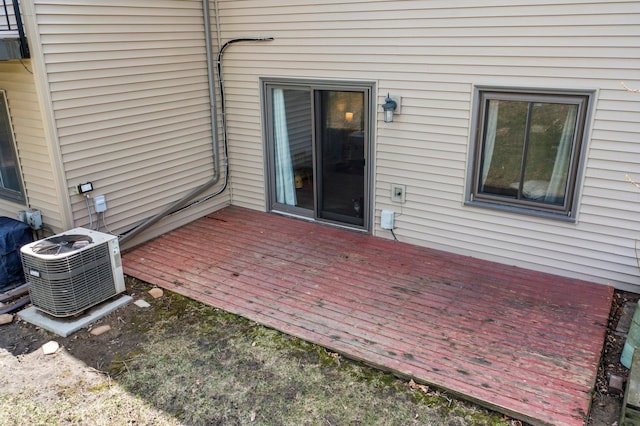 view of patio featuring a wooden deck and central air condition unit