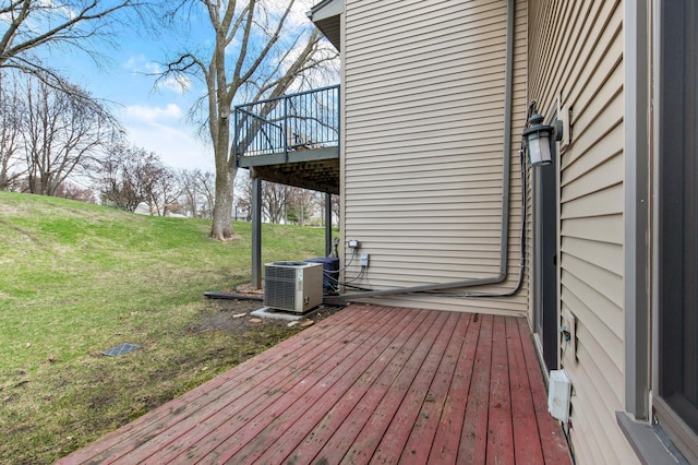 wooden terrace with central AC unit and a lawn