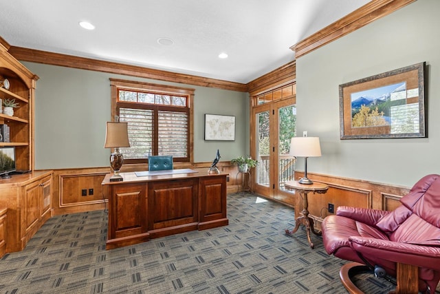 office space with crown molding, a wainscoted wall, and dark carpet