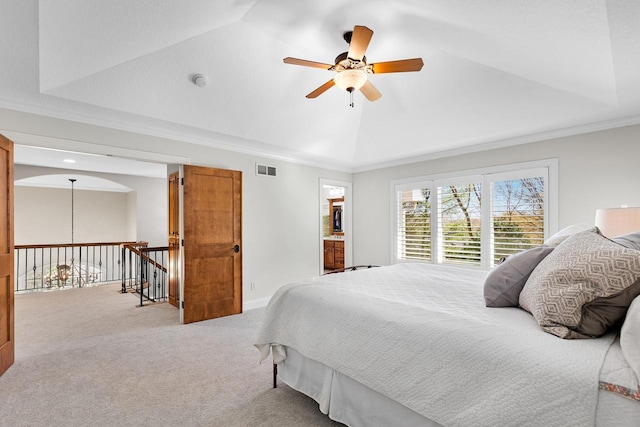 bedroom with crown molding, carpet floors, a ceiling fan, vaulted ceiling, and visible vents