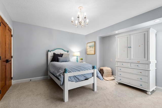 bedroom with a notable chandelier, light colored carpet, and baseboards