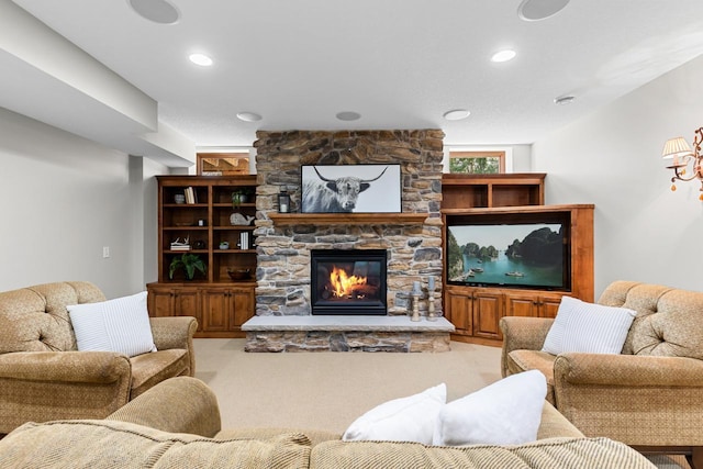 carpeted living area featuring a fireplace and recessed lighting