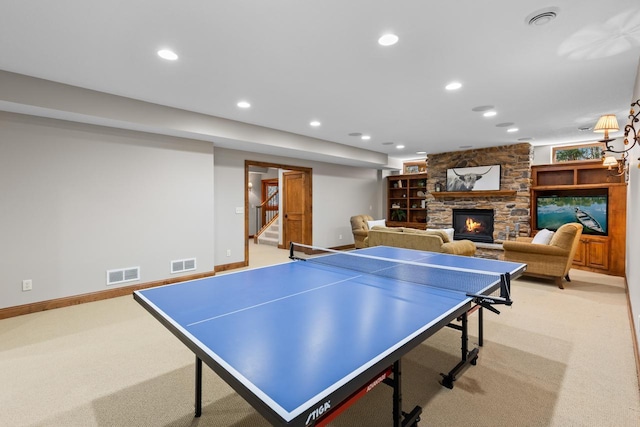 rec room with visible vents, recessed lighting, and a fireplace