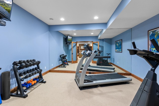 exercise area with carpet flooring, recessed lighting, and baseboards