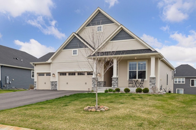 7393 Emily Cir, Lino Lakes, MN 55038 - craftsman-style house featuring covered porch, driveway, an attached garage, and a front yard