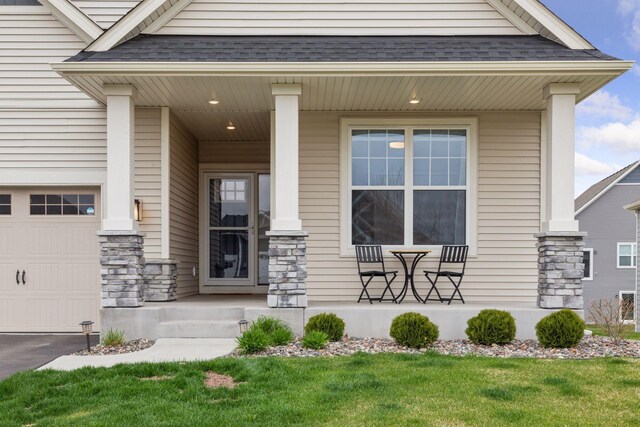 7393 Emily Cir, Lino Lakes, MN 55038 - doorway to property with stone siding, a porch, and roof with shingles