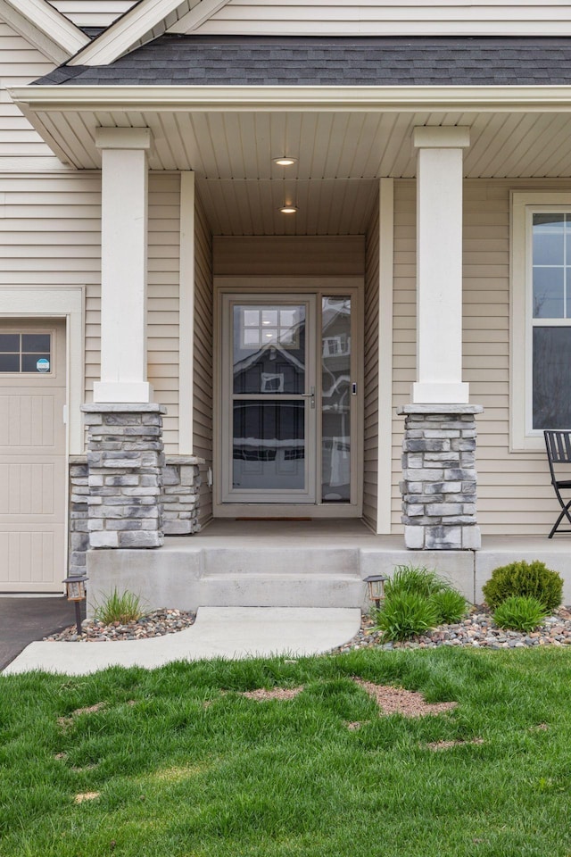 7393 Emily Cir, Lino Lakes, MN 55038 - entrance to property featuring a porch, a garage, and stone siding