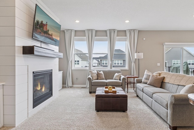 7393 Emily Cir, Lino Lakes, MN 55038 - carpeted living area featuring a fireplace, baseboards, and recessed lighting