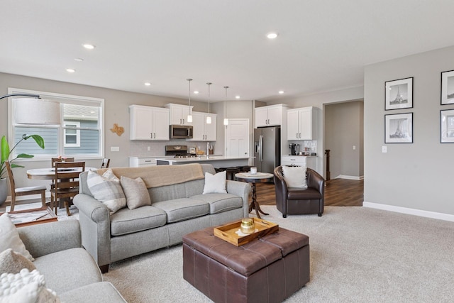 7393 Emily Cir, Lino Lakes, MN 55038 - living room featuring light colored carpet, baseboards, and recessed lighting