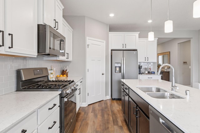 7393 Emily Cir, Lino Lakes, MN 55038 - kitchen with white cabinets, appliances with stainless steel finishes, a sink, and dark wood-type flooring