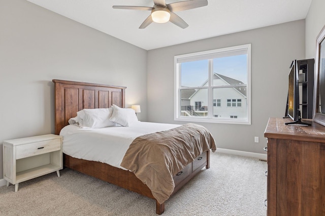 7393 Emily Cir, Lino Lakes, MN 55038 - bedroom with light colored carpet, baseboards, and a ceiling fan