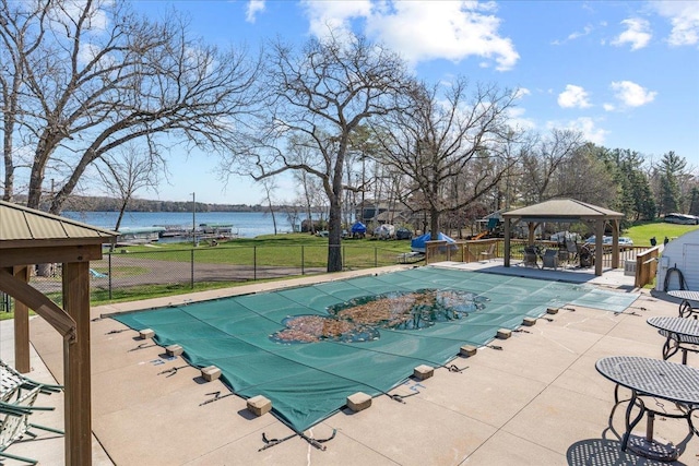 822 138th St Unit 32, Garfield Twp, WI 54001 - view of swimming pool with a water view, a gazebo, fence, a patio, and a covered pool