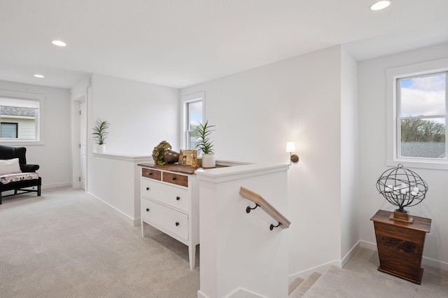 2301 Simply Living Ln, Hudson, WI 54016 - corridor featuring light carpet, healthy amount of natural light, recessed lighting, baseboards, and an upstairs landing