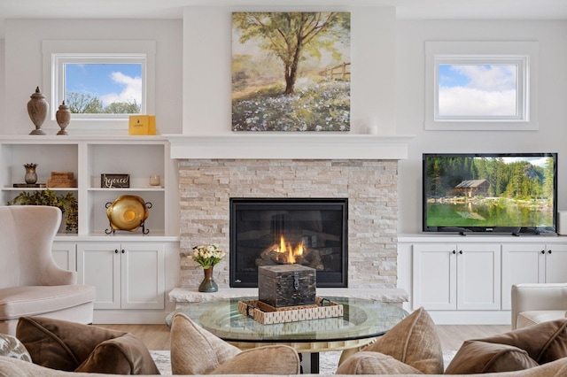 2301 Simply Living Ln, Hudson, WI 54016 - living area with light wood-style flooring and a fireplace