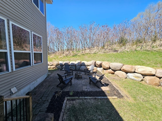 view of yard with a patio and a fire pit