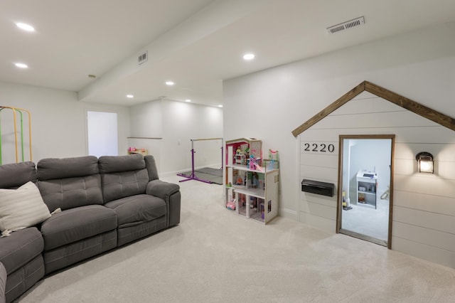 living area featuring carpet flooring, recessed lighting, and visible vents
