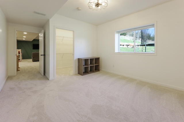 carpeted spare room with baseboards