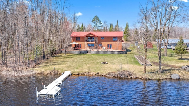 63626 Hannu Ln, Finlayson, MN 55735 - dock area featuring a lawn, a deck with water view, and an outdoor fire pit