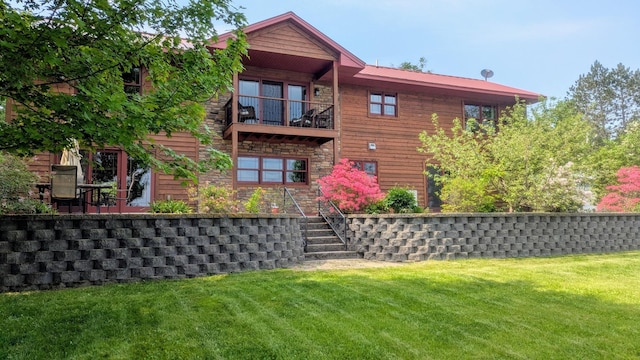 63626 Hannu Ln, Finlayson, MN 55735 - rear view of house featuring a balcony, a yard, stairway, and stone siding