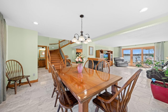 63626 Hannu Ln, Finlayson, MN 55735 - dining area with stone tile flooring, a chandelier, stairway, baseboards, and recessed lighting