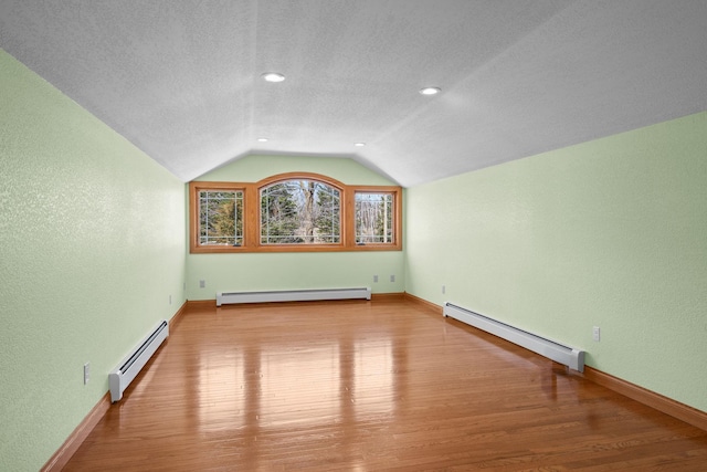 63626 Hannu Ln, Finlayson, MN 55735 - bonus room with a baseboard radiator, wood finished floors, lofted ceiling, a textured ceiling, and a textured wall