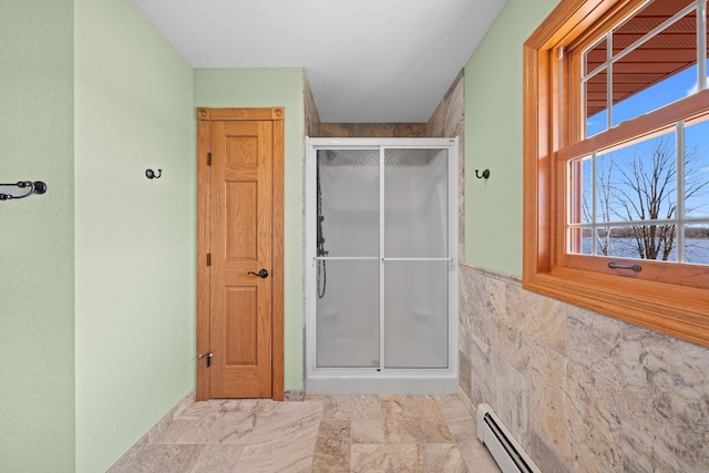 63626 Hannu Ln, Finlayson, MN 55735 - full bathroom with a shower stall, plenty of natural light, baseboard heating, tile walls, and wainscoting