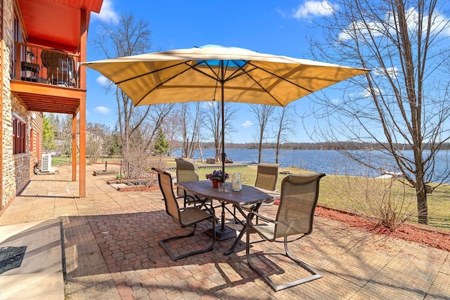 63626 Hannu Ln, Finlayson, MN 55735 - view of patio / terrace with outdoor dining space, a water view, a balcony, and cooling unit