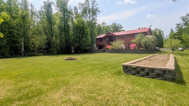 63626 Hannu Ln, Finlayson, MN 55735 - view of green lawn with an outdoor fire pit