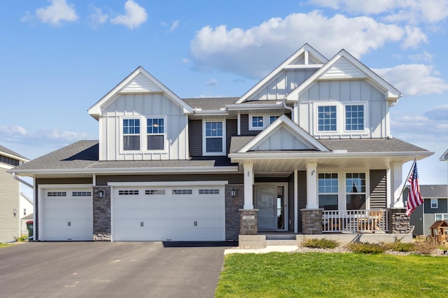 2133 Johanna Cir, Lino Lakes, MN 55038 - craftsman inspired home with board and batten siding, covered porch, asphalt driveway, a garage, and stone siding