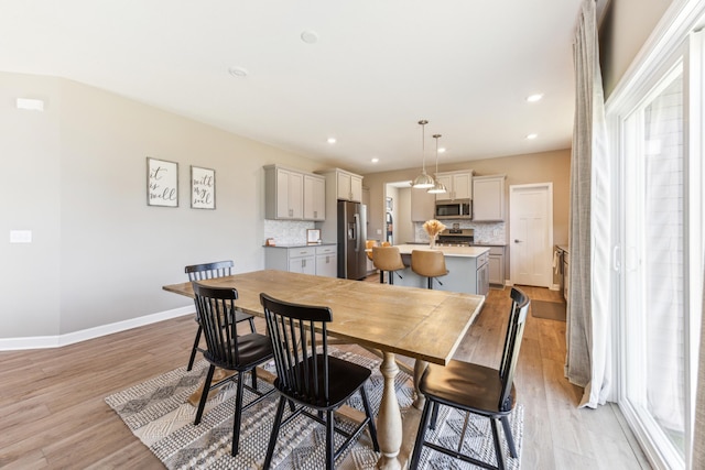 2133 Johanna Cir, Lino Lakes, MN 55038 - dining area featuring healthy amount of natural light, light wood-style flooring, baseboards, and recessed lighting