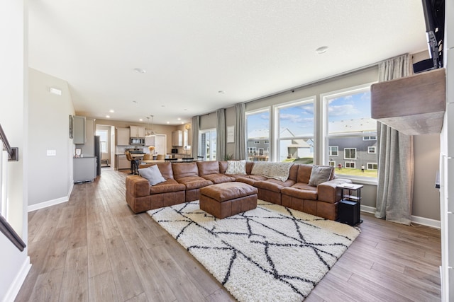 2133 Johanna Cir, Lino Lakes, MN 55038 - living room featuring light wood-style floors, baseboards, and recessed lighting