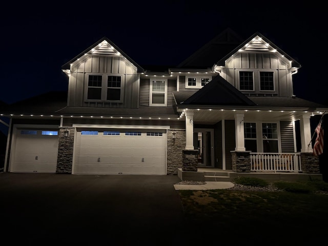 2133 Johanna Cir, Lino Lakes, MN 55038 - craftsman-style home featuring board and batten siding, stone siding, covered porch, and a garage