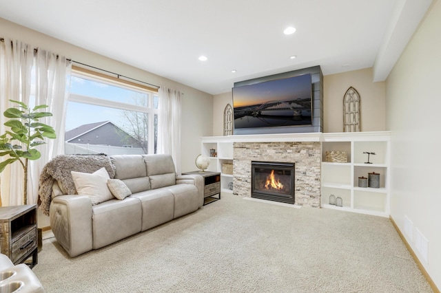 562 Hillside Dr, Prescott, WI 54021 - carpeted living room with a fireplace and recessed lighting