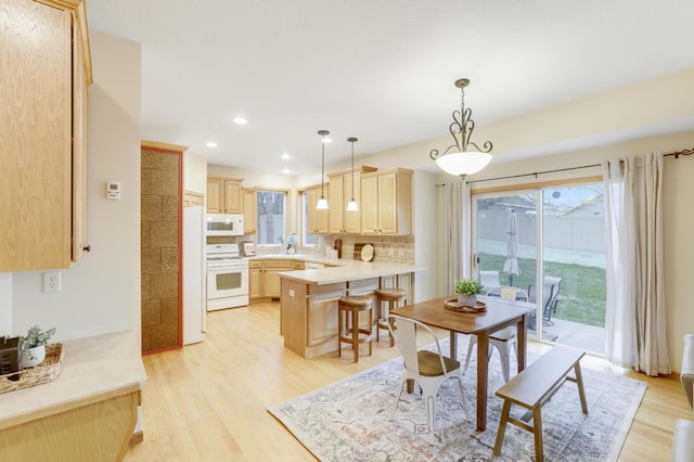 562 Hillside Dr, Prescott, WI 54021 - dining area featuring light wood finished floors and recessed lighting