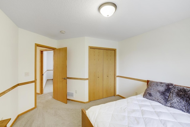 562 Hillside Dr, Prescott, WI 54021 - carpeted bedroom featuring a closet and baseboards
