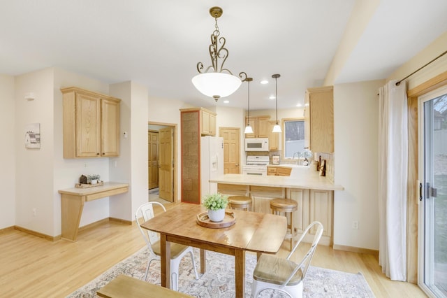 562 Hillside Dr, Prescott, WI 54021 - dining space with light wood-style flooring, baseboards, and recessed lighting