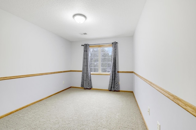 562 Hillside Dr, Prescott, WI 54021 - empty room with carpet floors, baseboards, and a textured ceiling