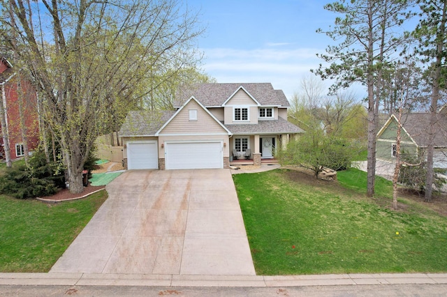 562 Hillside Dr, Prescott, WI 54021 - traditional-style home with a garage, concrete driveway, a front lawn, and a shingled roof
