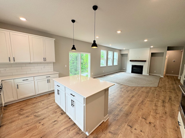 14234 Empire Ln N, Dayton, MN 55327 - kitchen with white cabinetry, light countertops, decorative light fixtures, and recessed lighting