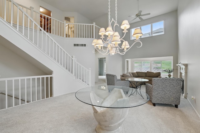 5541 70th St, Edina, MN 55439 - carpeted dining area with a high ceiling, ceiling fan, a chandelier, and baseboards