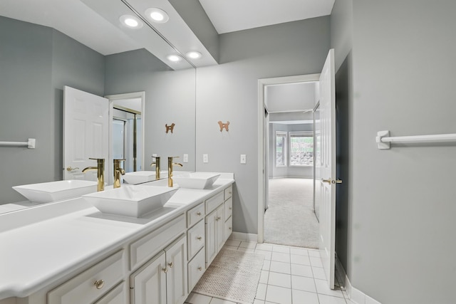5541 70th St, Edina, MN 55439 - bathroom with recessed lighting, double vanity, baseboards, and tile patterned flooring