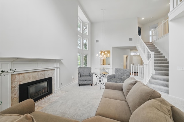 5541 70th St, Edina, MN 55439 - living area featuring carpet flooring, a high ceiling, stairway, plenty of natural light, and a tile fireplace