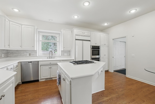 5541 70th St, Edina, MN 55439 - kitchen featuring stainless steel appliances, white cabinets, a sink, tasteful backsplash, and recessed lighting