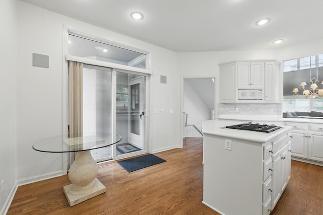 5541 70th St, Edina, MN 55439 - kitchen featuring white microwave, gas stovetop, white cabinetry, recessed lighting, and light countertops