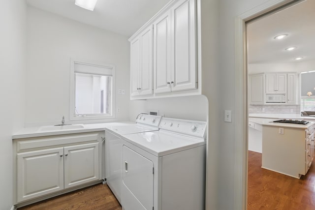 5541 70th St, Edina, MN 55439 - washroom with washing machine and clothes dryer, wood finished floors, cabinet space, and recessed lighting