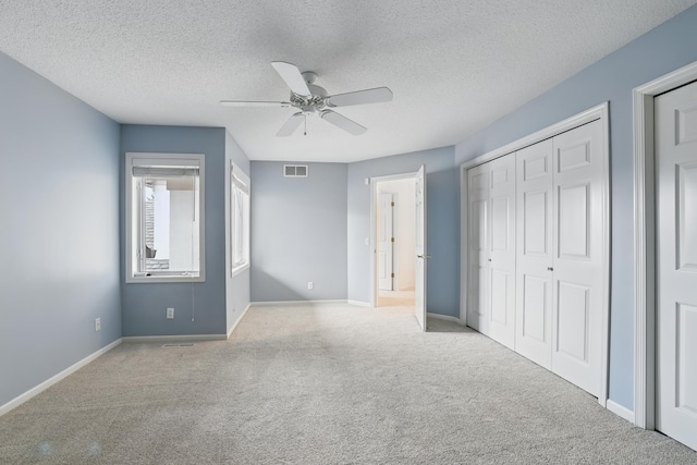 5541 70th St, Edina, MN 55439 - unfurnished bedroom with carpet flooring, baseboards, a textured ceiling, a closet, and ceiling fan